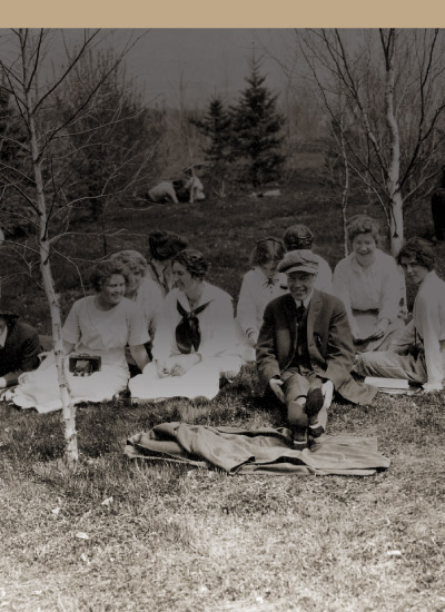 Photo of people sitting at a picnic