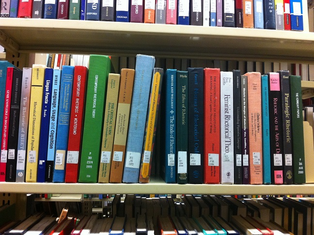 Image of books on a metal library shelf
