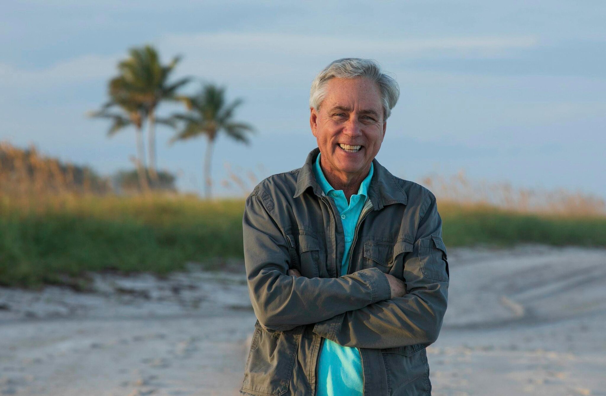 A photo of Carl Hiaasen on a beach in Florida