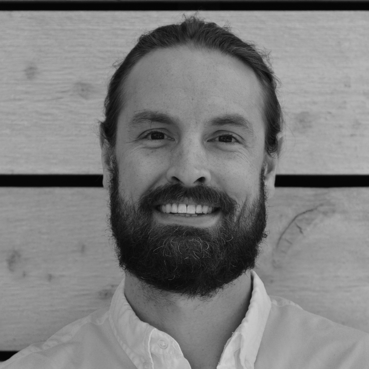 Professional black and white headshot of Dr Justin D Shanks