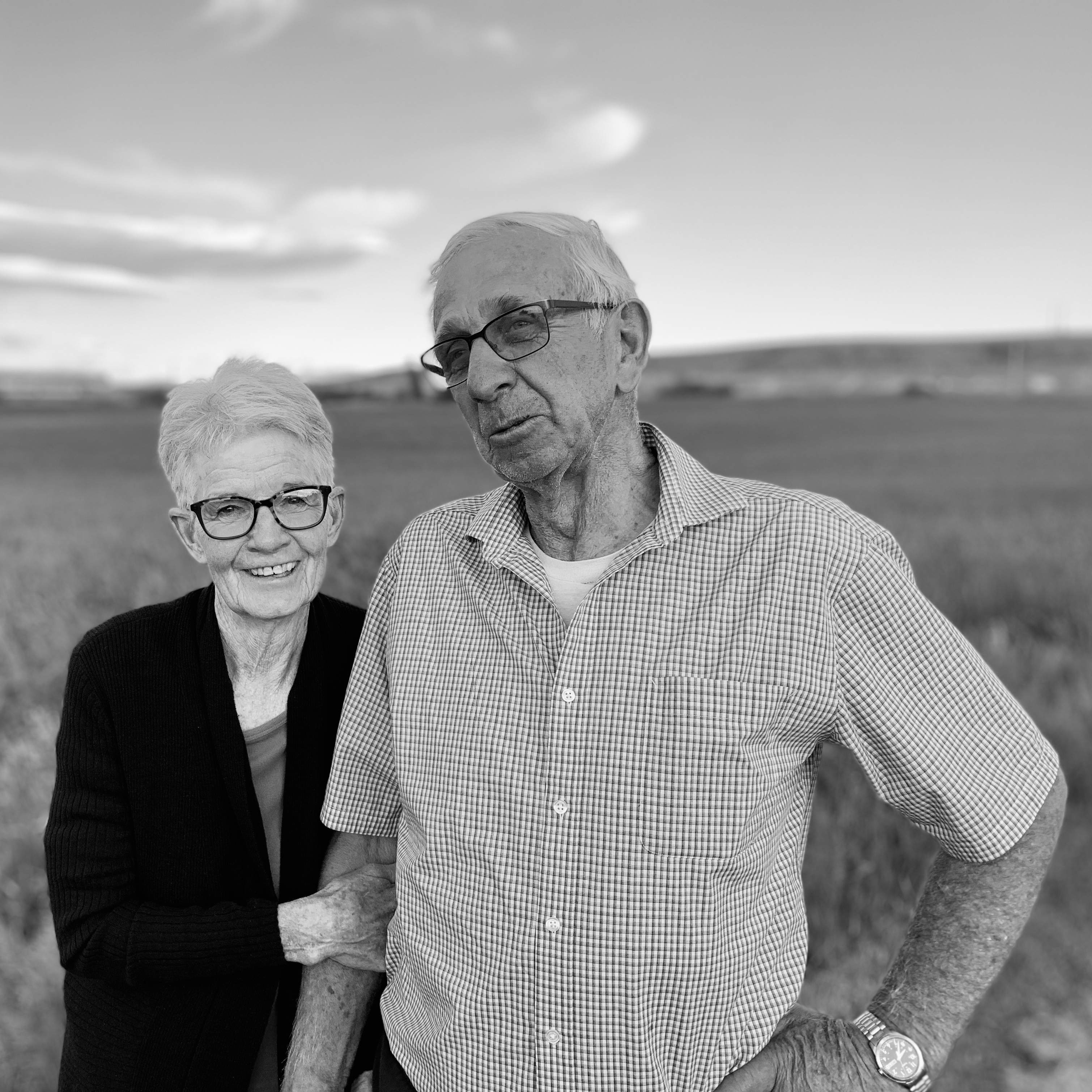 Photograph of Charlon and Loren Alberda standing beside a field